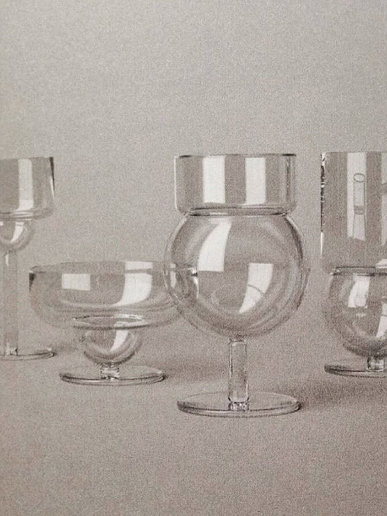 Set of clear glassware on a neutral background
