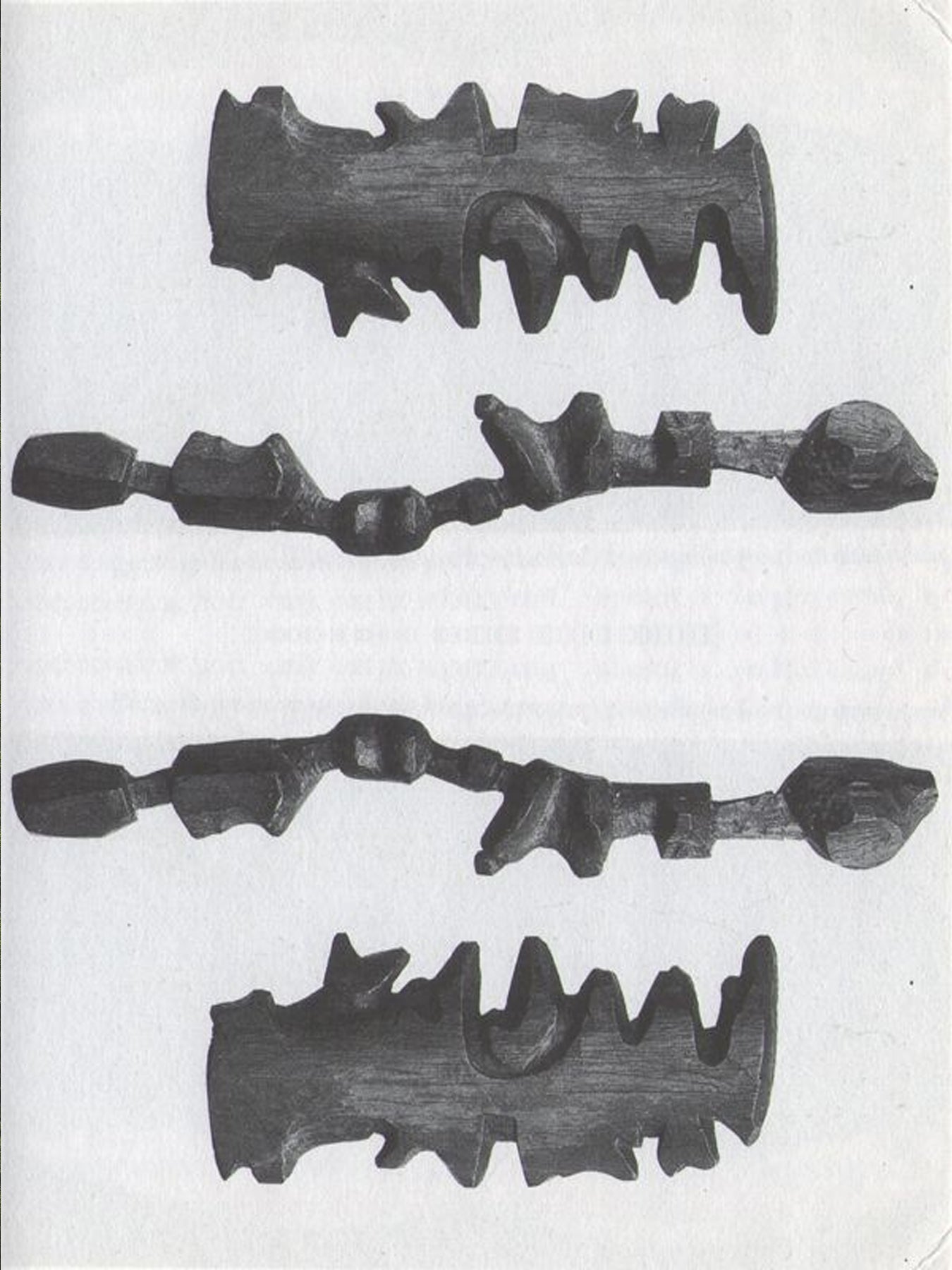 Set of four wood carvings on a white background