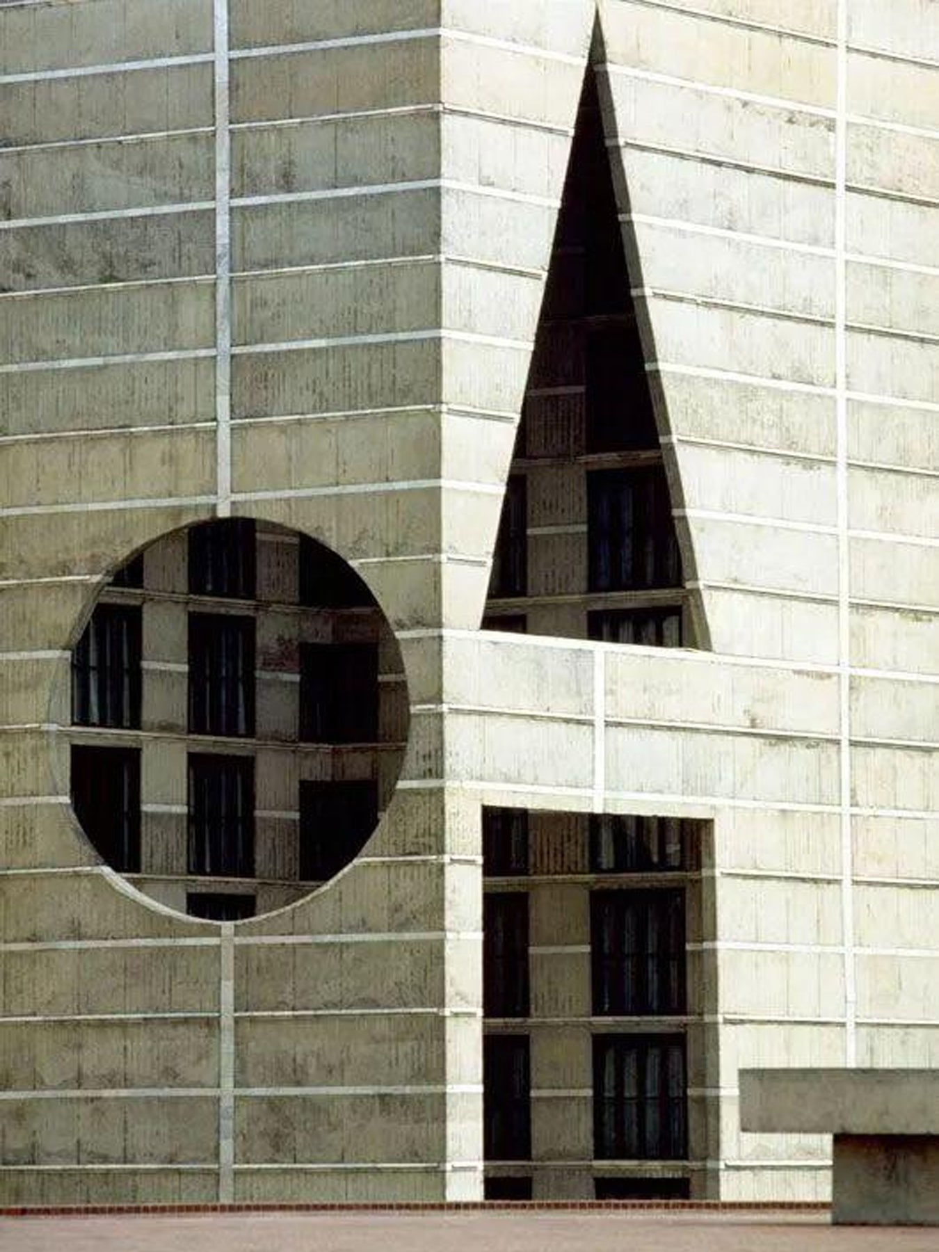 Modern architectural design with geometric shapes on a building facade