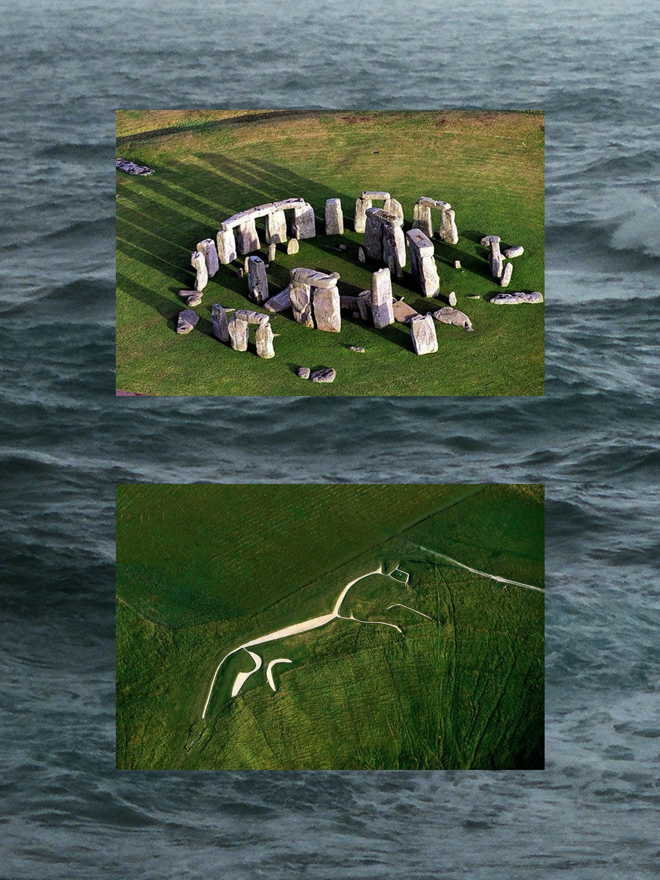 Stonehenge and a long snake-like structure on grass with water background