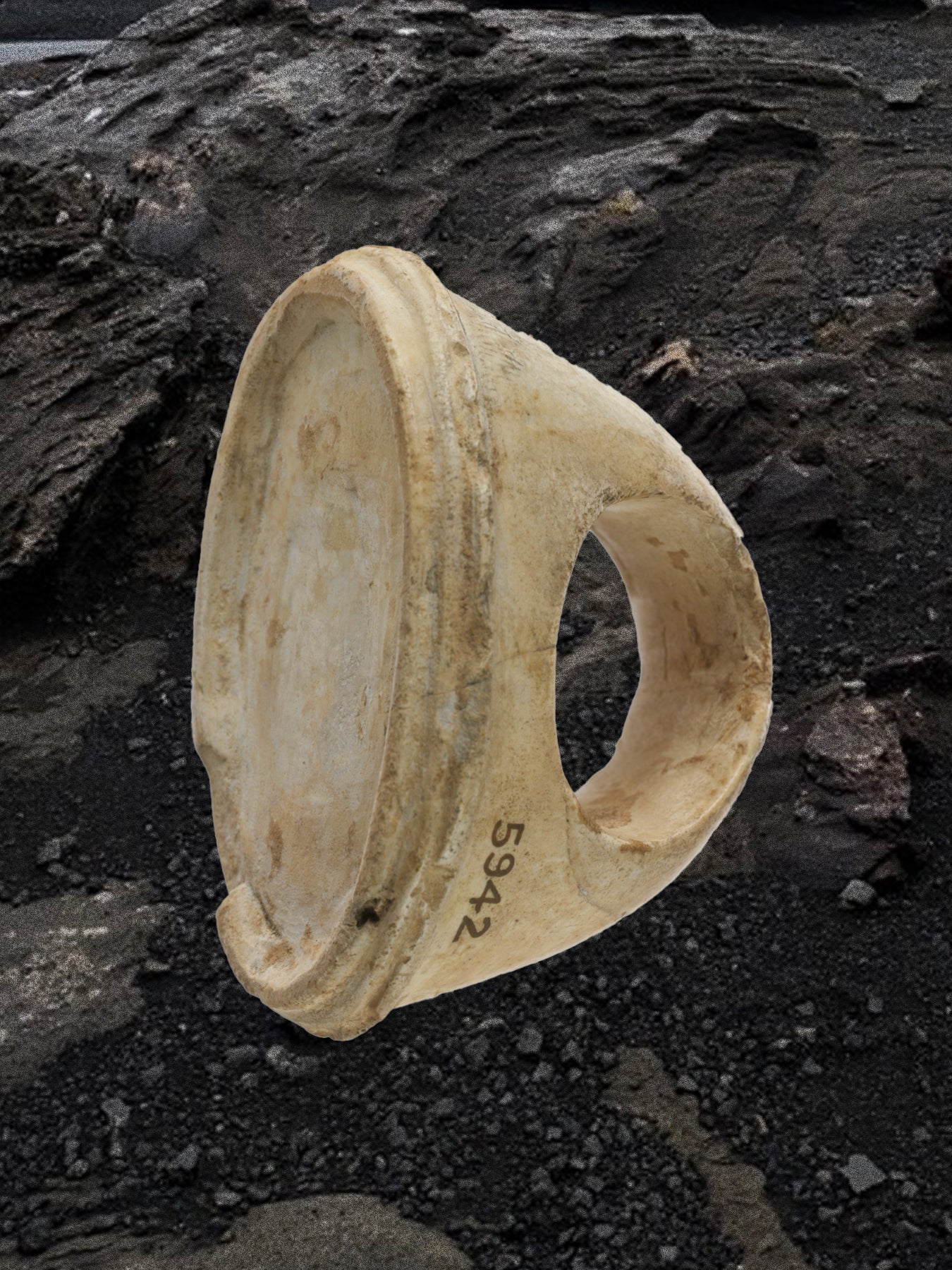 Ancient ring on a dark stone surface